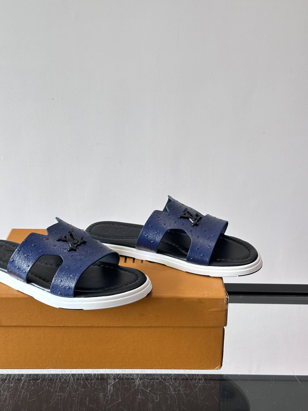 Louis Vuitton Embossed Blue Slide Sandals — side