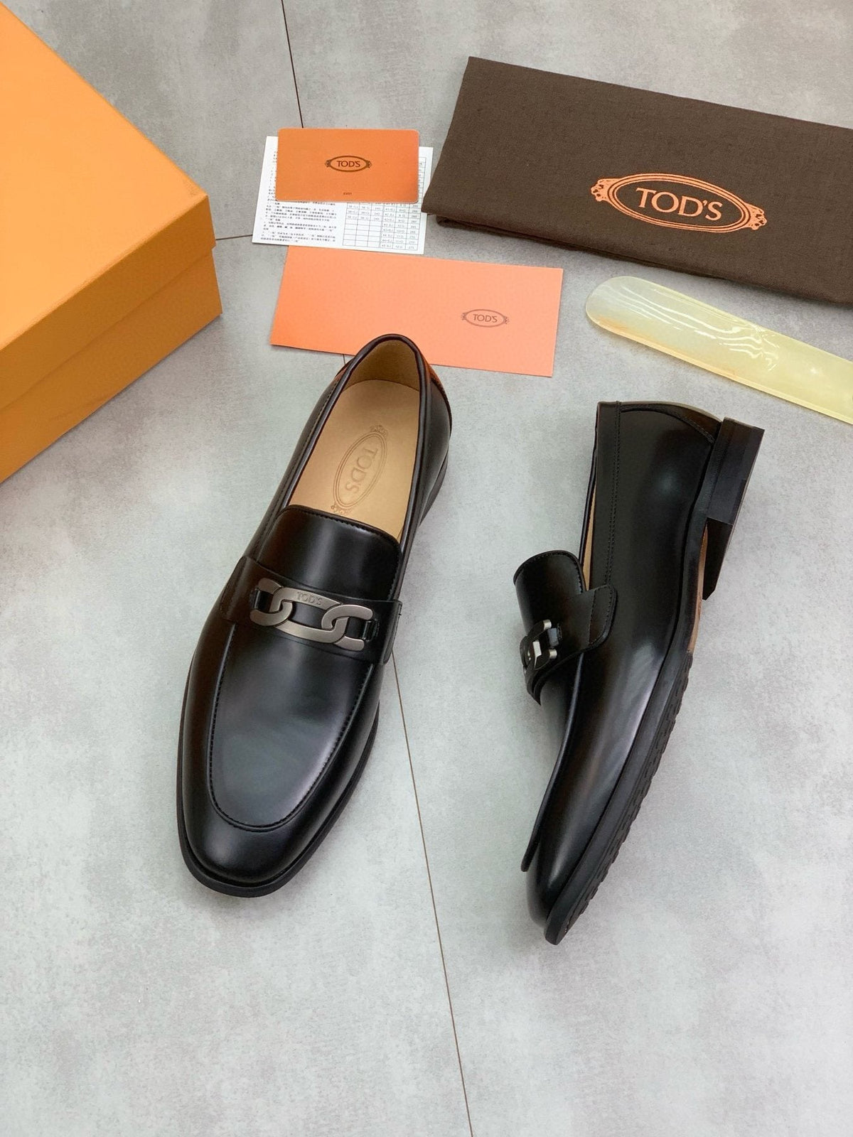 TOD'S Black Metal-Accent Loafers — side